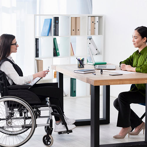 A professional providing one-on-one Disability Employment Support in an office setting in Perth, WA.